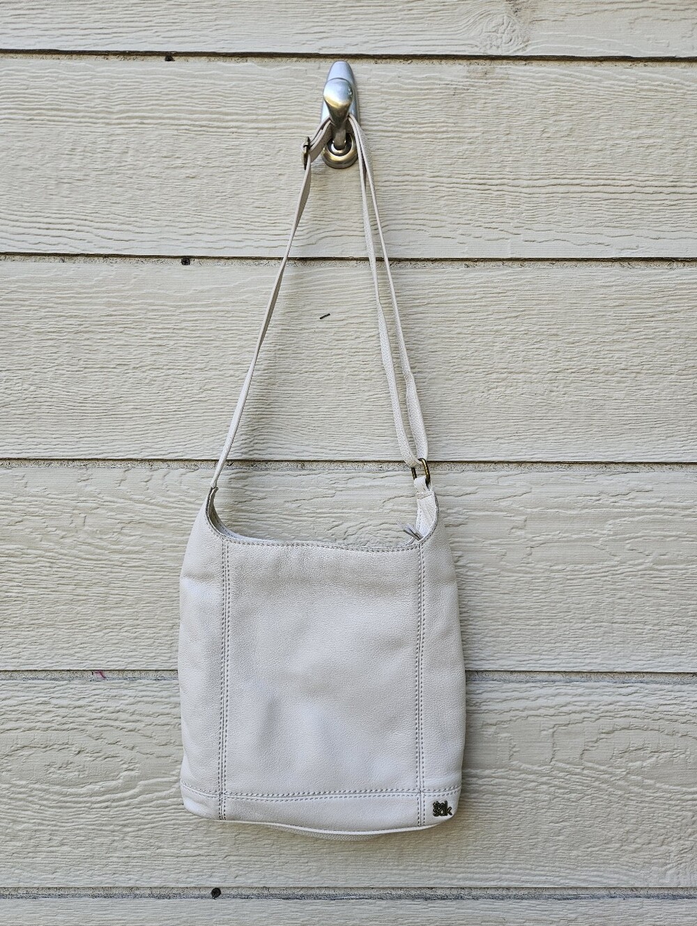 The Sak off-white leather crossbody bag